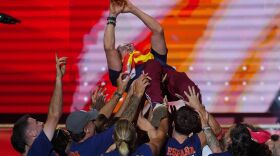 Spain's head football coach, Luis de la Fuente, is carried aloft by his players during celebrations at Cibeles Square in Madrid on Monday, July 20, 2026, after Spain defeated Argentina in the World Cup final in East Rutherford, N.J., near New York. (AP Photo/Manu Fernandez)
