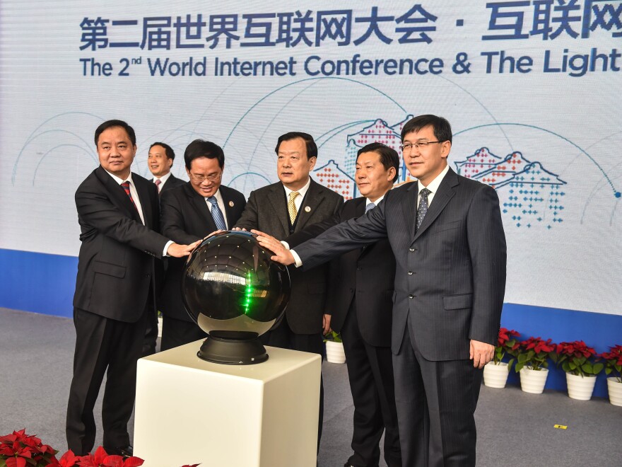 China's Cyberspace Administration minister Lu Wei (second from right) and other officials attend the opening ceremony of the Light of the Internet Expo on Tuesday as part of the Second World Internet Conference, which starts Wednesday. Lu has said that controlling the Internet is about as easy as "nailing Jell-O to the wall."