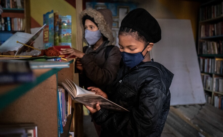 Bernalee Victor, 12, is a daily visitor at the Hot-Spot library. Her favorite book so far, she says, is an adaptation of the TV movie <em>High School Musical.</em>