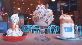 Large bowls of Blue Bunny ice cream sit on a table. 