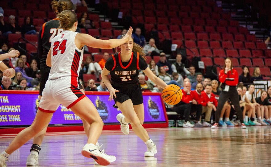Girls high school basketball players inside an arena