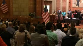Local dignitaries, 96 immigrants, and their families pledged allegiance to the American flag.