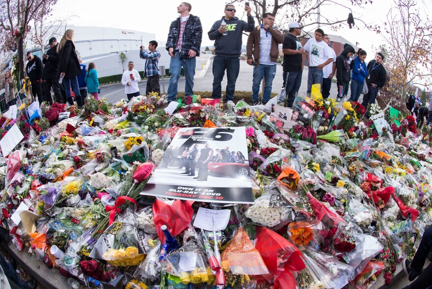 Fans pay tribute to Paul Walker at a memorial in Valencia, Calif., on Dec. 8, 2013.