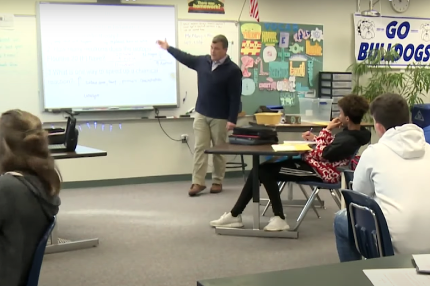 Keith Morey explains the concept of a theory at Centerville-Abington Junior High School.