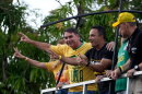 Opposition presidential candidate Sen. Flavio Bolsonaro, left, gestures to supporters from a vehicle during a campaign motorcade in Belem, Para state, Brazil, Monday, Sept. 14, 2026.