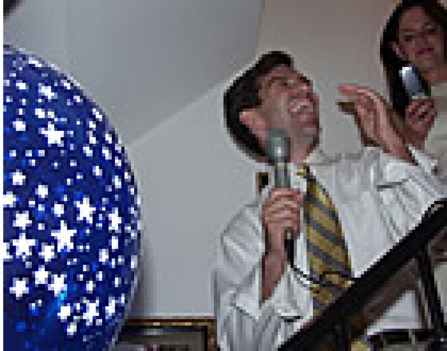 State Senator-elect Jeff Smith laughs during his speech to supporters Tuesday night (KWMU photo/Tom Weber)