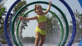 Alivia Parker, 21 months at the time, ran through circles of spraying water on a hot day in Montgomery, Ala., last June. She was wearing sunscreen with an SPF of 100, a rating that won't be allowed much longer.