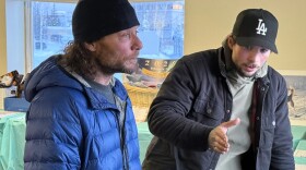 Jason Mackey, left, and his son Patrick Mackey, right, recount their experiences on the trail. The younger Mackey took home this year’s Red Lantern.