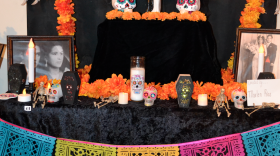 A traditional ofrenda, an altar with artfully arranged gifts and mementos as offerings to the deceased for DÃ­a de los Muertos.