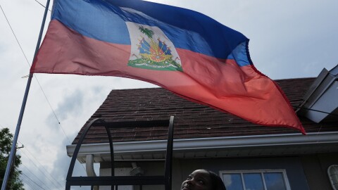 Patricia Grace Louis-Jacques, a nursing student who has close Haitian family members and friends affected by the end of TPS, poses for a photo outside the Caribbean Creole Café in Salisbury, Md., Sunday, Aug. 2, 2026. (AP Photo/Luis Andres Henao)