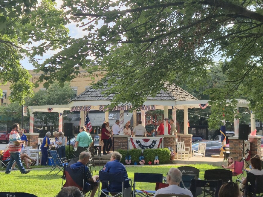 Candidates gather under the gazebo on Ozark's courthouse lawn, ahead of a forum with Christian County voters.