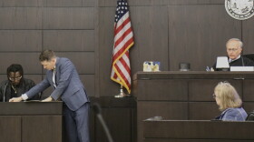 Assistant State Attorney Ryan Nagel shows evidence to Ian “Bob” Munnerlyn during his testimony Wednesday, Sept. 23, 2026. Munnerlyn and his girlfriend, Christin Cassels, lived together at the time of her 2017 killing. (Katie Klaiber/WUFT News)
