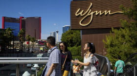 People walk near the Wynn Las Vegas resort on Wednesday, July 26, 2023, in Las Vegas.