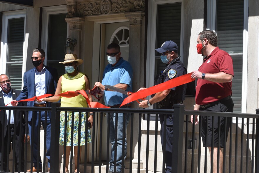 Officials cut the ribbon on the Police Resident Officer home in North Valley on Wednesday, July 29, 2020.