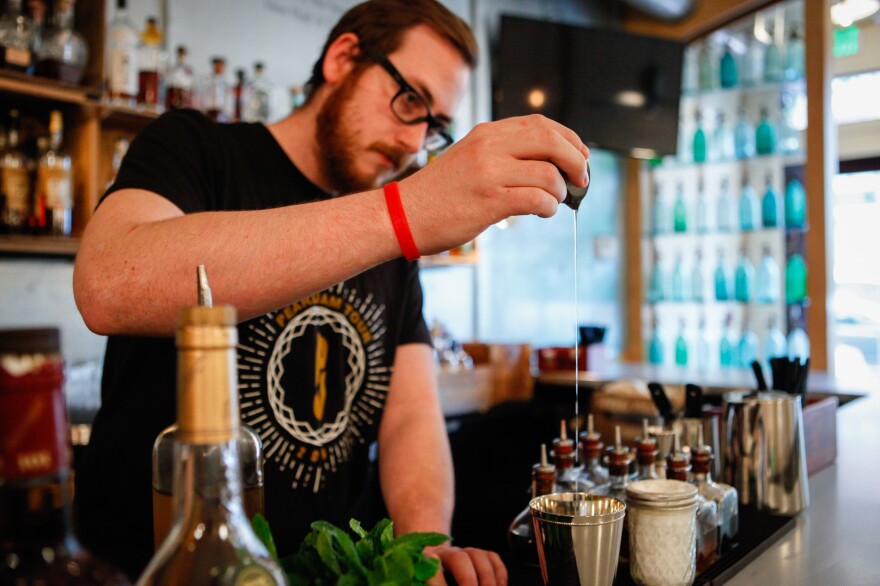 Paul Taylor demonstrates how to make a mint julep and a champagne julep at Southern Efficiency, a D.C. bar owned by mixologist Derek Brown. Here, Taylor pours in simple syrup. (See recipes below.)