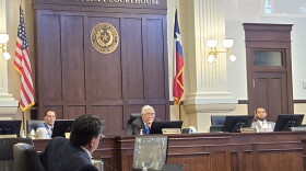 Bexar County Judge Peter Sakai, center, presides over county commissioners meeting at the county courthouse