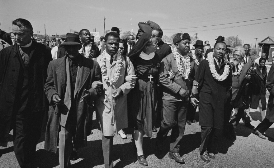 John Lewis (third from the left) joins Rev. Martin Luther King as they begin the march from Selma to Montgomery in March 1965.