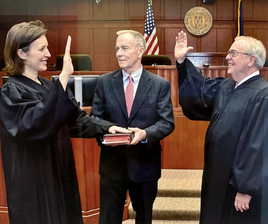 Fayette Circuit Judge Lucy VanMeter being sworn into office, with her husband and former Kentucky Supreme Court Chief Justice Laurance Vanmeter (middle) and former Chief Justice John Minton (right), who is supporting her campaign for the Court of Appeals.