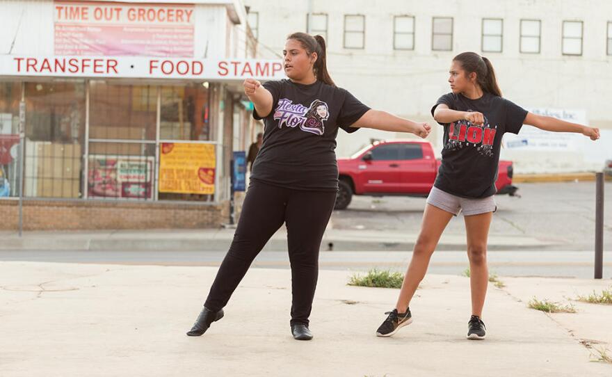 Two dancers practice in an empty lot next to their International Dance Studio (IDance) in Capitol Hill.
