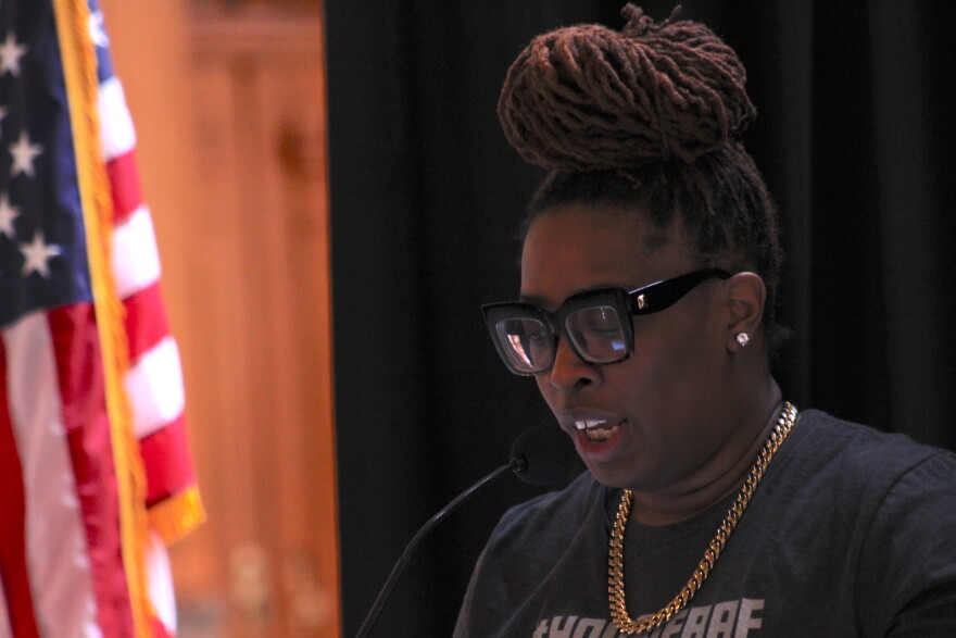 Jessica Louise with All-Options Pregnancy Resource Center discusses the importance of protecting the right to an abortion at an event at the Statehouse (Ben Thorp/WBAA News).