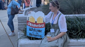 In the finest Bavarian beer hall tradition, a friendly fraulein welcomed Oktoberfest attendees.