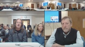 Park County Commissioner Mike Story listens to comments from residents Mary Sue Brenner and Darrell Jensen at the February 10 Park County commissioner meeting.