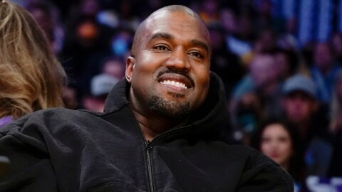 FILE - Kanye West, known as Ye, watches the first half of an NBA basketball game between the Washington Wizards and the Los Angeles Lakers, on March 11, 2022, in Los Angeles. (AP Photo/Ashley Landis, File)
