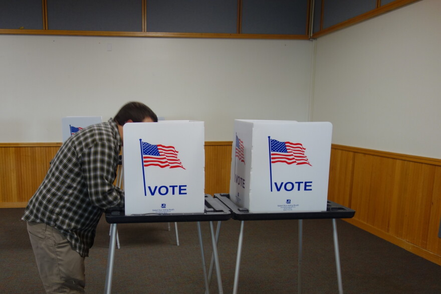 A voter casts their ballots in Bethel's municipal election and REAA election at the Yupiit Picaryarait Cultural Center in Bethel on Oct. 6, 2026.