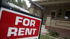 A "for rent" sign is posted outside a home in Denver.