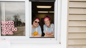 Two employees at Stir It Up's walk-up window.