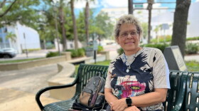 Woman sits on a park bench