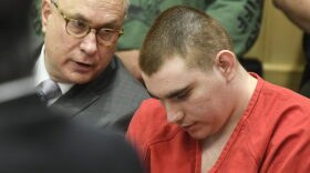 Special Assistant Public Defender David Frankel, left, talks with his client school shooting suspect Nikolas Cruz, center, sits in the Broward County courthouse in Fort Lauderdale, Fla., Friday, June 8, 2018. Cruz's attorneys are arguing against the release of his full confession. His attorneys cite concerns over causing more trauma to the Parkland community and harming their client's right to a fair and impartial trial. Cruz, 19, is charged with 17 counts of murder and 17 counts of attempted murder in the Feb. 14, 2018, school shooting at Marjory Stoneman Douglas High School in Parkland, Fla. (Taimy Alvarez/South Florida Sun-Sentinel via AP, Pool)