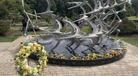 Well-wishers surrounded the Comair Flight 5191 memorial statue with flowers Aug. 27, 2026, commemorating the 49 lives lost in the crash 20 years prior.