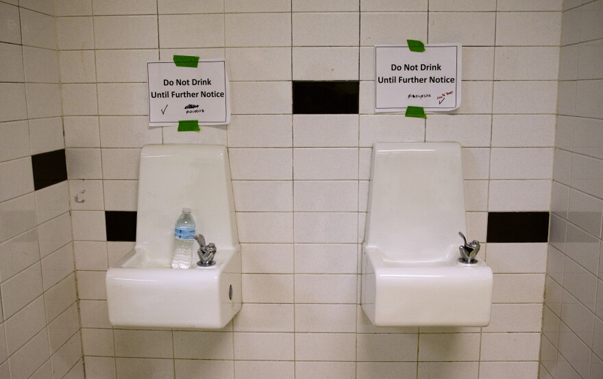 Drinking fountains are marked "do not drink until further notice."