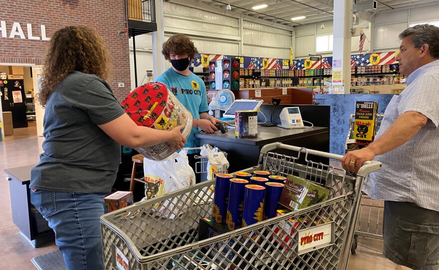 Donna Nuccio (left), store manager at Pyro City store near Lone Jack, Mo., assists a customer.