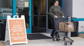 Taylor Desert, a TSA agent, leaves Gleaners Food Bank after picking up groceries in Indianapolis, Monday, March 23, 2026.
