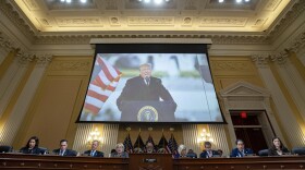 A video of former President Donald Trump is shown on a screen as the House select committee investigating the Jan. 6 attack on the U.S. Capitol holds its final meeting on Capitol Hill in Washington, Monday, Dec. 19, 2022. From left, Rep. Stephanie Murphy, D-Fla., Rep. Pete Aguilar, D-Calif., Rep. Adam Schiff, D-Calif., Rep. Zoe Lofgren, D-Calif., Chairman Bennie Thompson, D-Miss., Vice Chair Liz Cheney, R-Wyo., Rep. Adam Kinzinger, R-Ill., Rep. Jamie Raskin, D-Md., and Rep. Elaine Luria, D-Va.
