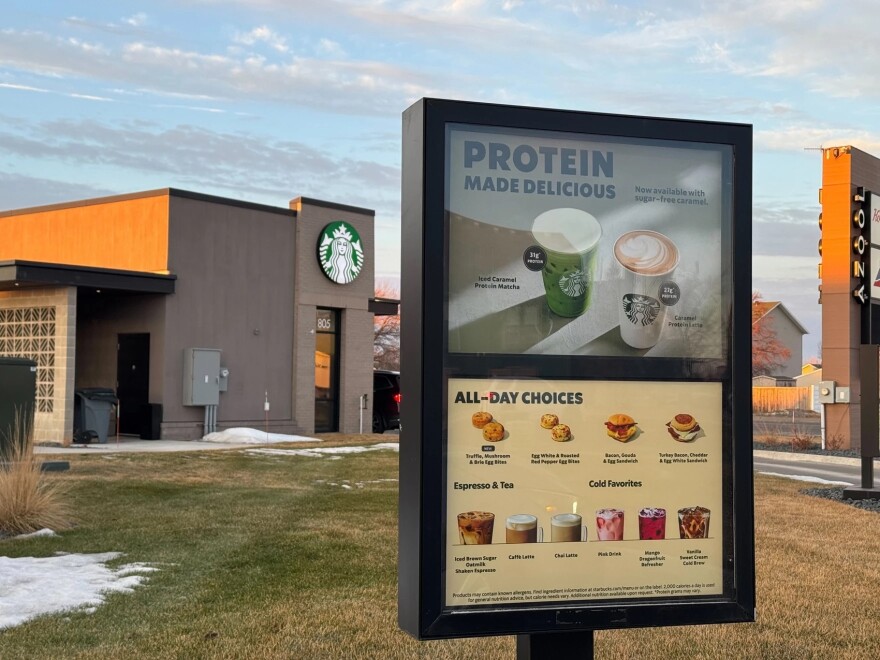 A sign at the entrance of a Starbucks drive-thru in Moorhead, MN advertises the brand's new protein-rich drink lineup on Tuesday, Feb. 17, 2026.