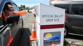 Sherri Seaman of Waldport drops her ballot in the special ballot box outside of the Lincoln County courthouse on election day Tuesday, May 19.