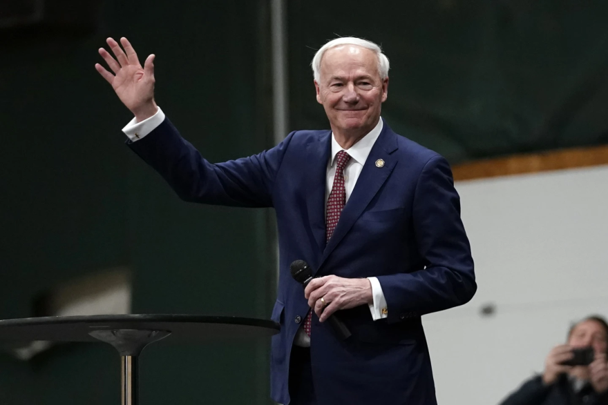 Former Arkansas Gov. Asa Hutchinson speaks at a caucus site in Clive, Iowa, Monday, Jan. 15, 2024.