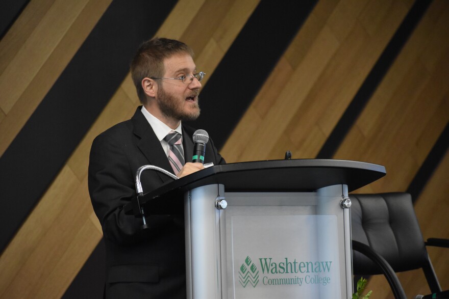 Gabriel Ehrlich, an economic forecaster from the University of Michigan, speaks at a Washtenaw Economic Club event at Washtenaw Community College on March 14, 2023