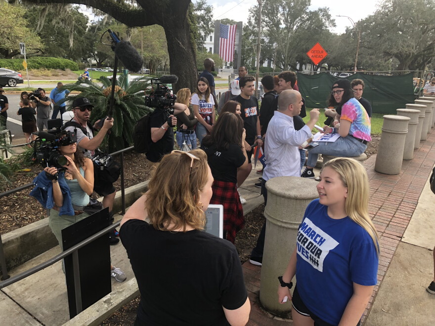 Marjory Stoneman Douglas High School senior Jaclyn Corin, right, and other students who founded March For Our Lives after the Feb. 14 shooting, talk to reporters following a press conference near the state Capitol in Tallahassee.