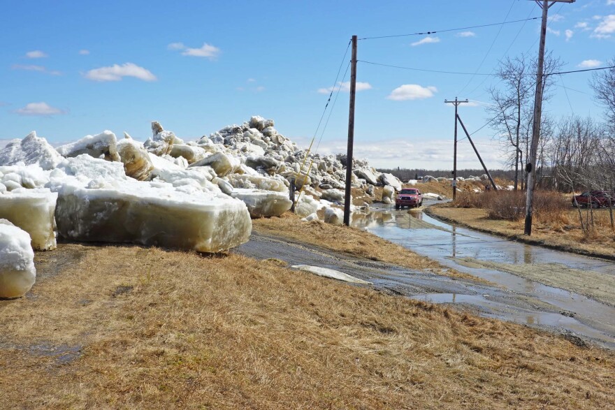 Ice pushed up and over a concrete-reinforced dike in Aniak during breakup of the Kuskokwim River on May 8, 2026.