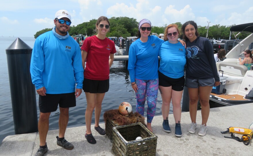 FIU research team with their two traps after the competition.