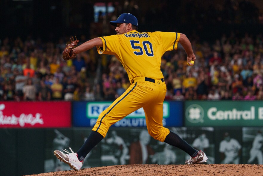 Retired St. Louis Cardinals pitcher Adam Wainwright throws a pitch during a baseball game between the Savannah Bananas and the Party Animals at Busch Stadium on Friday, July 18, 2025, in downtown St. Louis.