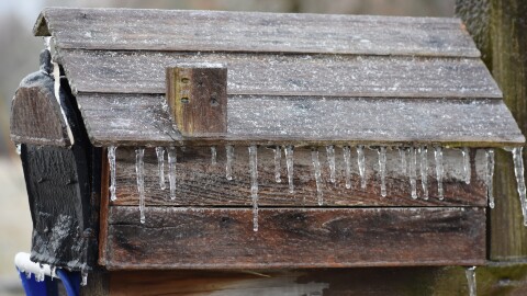 Ice covers a mailbox on a cold winter day (file)