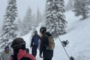 Skiers stand on a tour of whitebark pine at Whitefish Mountain Resort