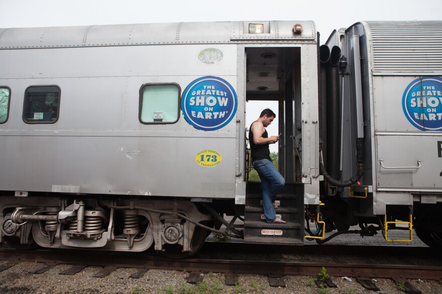 Audio engineer Jeff Bell, 33, hangs out on the train the day of a performance.