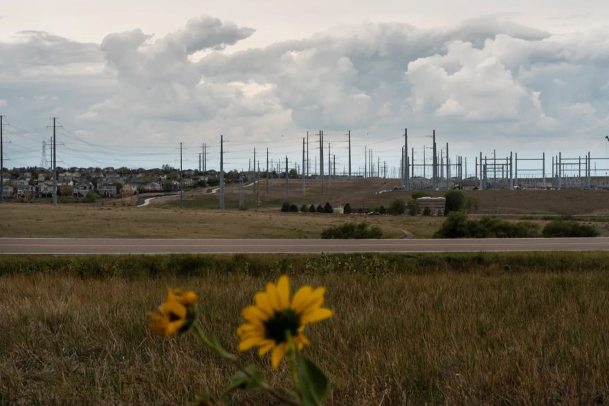 Power lines extend near a neighborhood in Aurora from the Harvest Mile Substation, part of Xcel Energy’s Power Pathway.