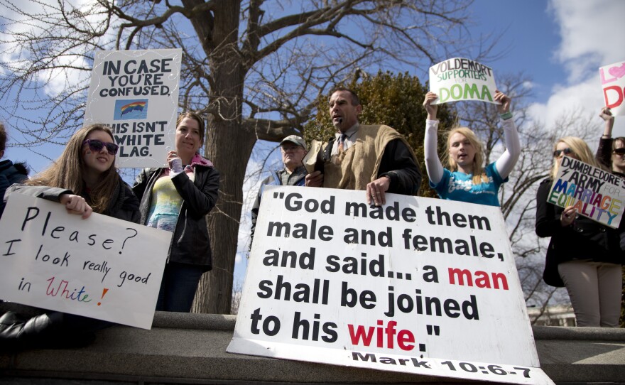 Allan Hoyle of North Carolina (center) protests gay marriage outside the Supreme Court.